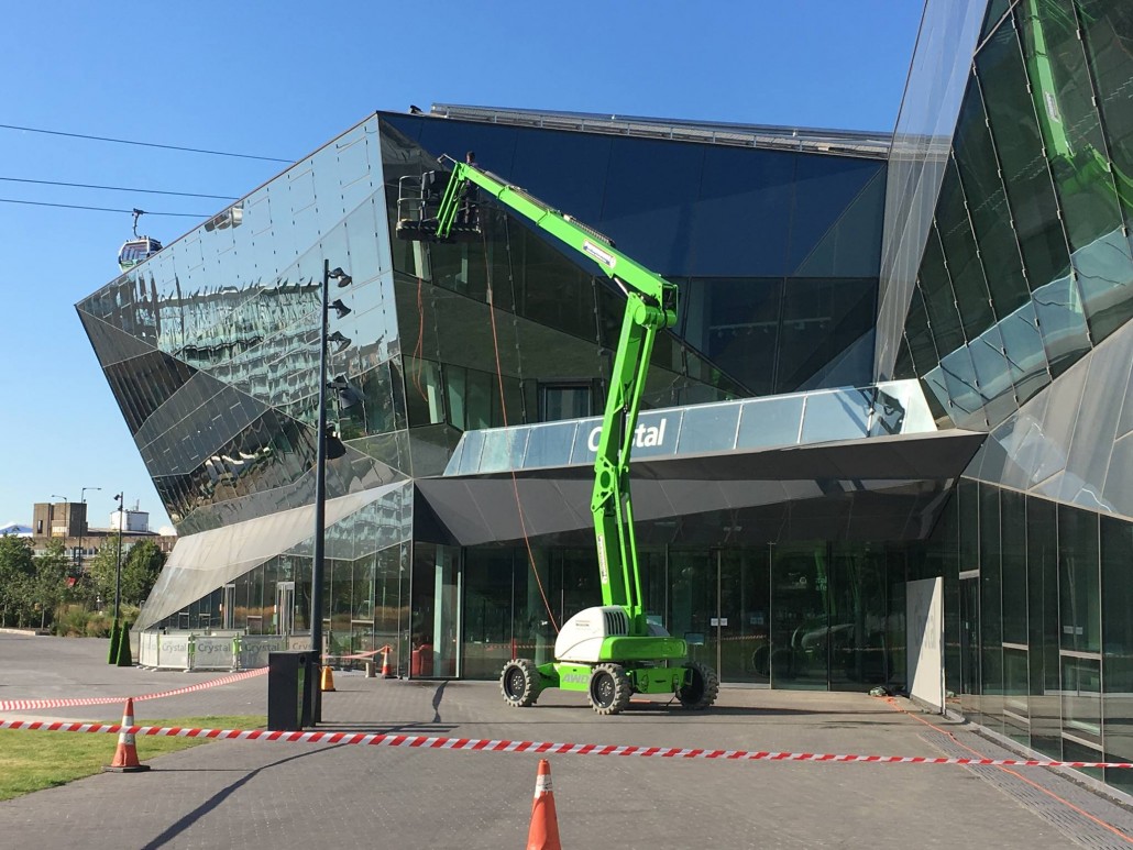 Commercial window cleaning using a Hydraulic platform.