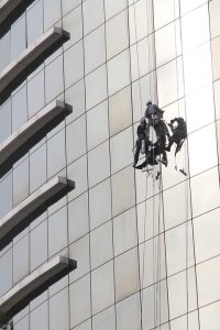 High-rise window cleaners coming down a high building.