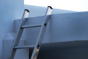 Ladders against a wall.